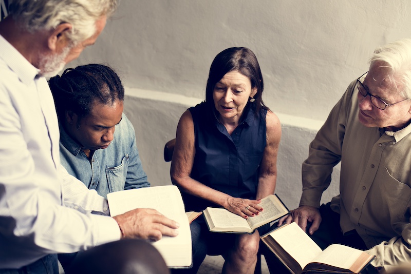 Group christianity people reading bible together